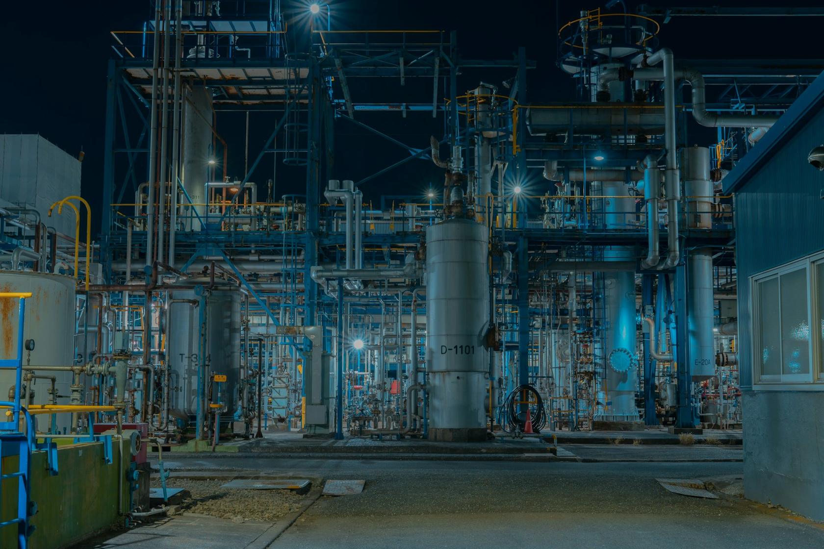 Process plant with columns and piping at night